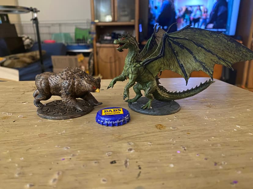 An Owlbear and Green Dragon I 3d printed and painted for D&D.